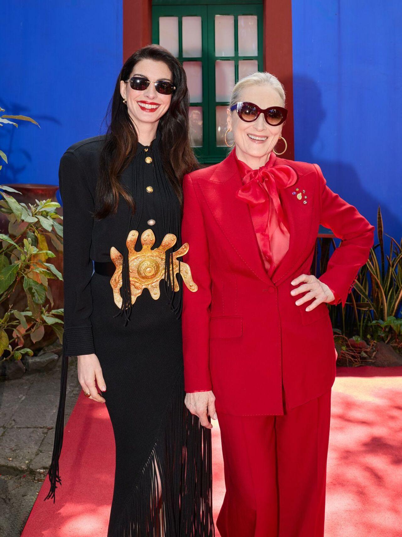 For the Mexico City press tour, Meryl Streep made a striking statement in a monochromatic "devil-red" suit by Dolce &amp; Gabbana. She completed the look with burgundy cat-eye frames.